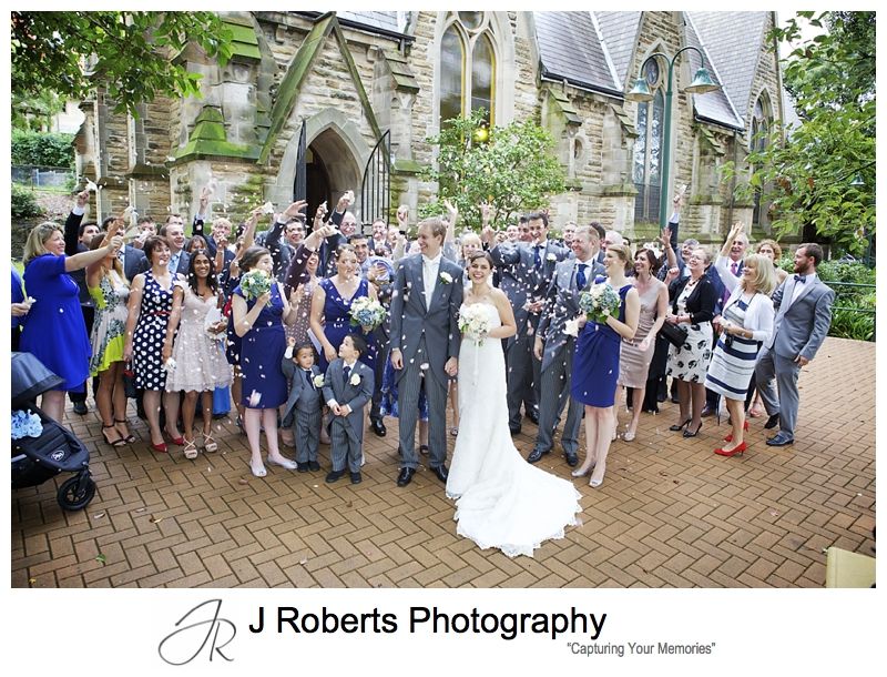 Petals thrown at guests celebrate wedding - sydney wedding photography
